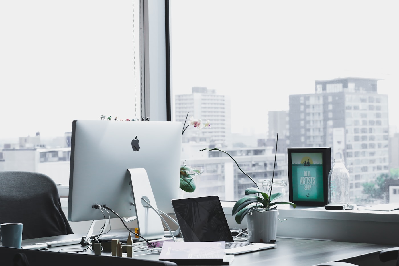 Editorial web design - creative studio workspace with magazine layouts