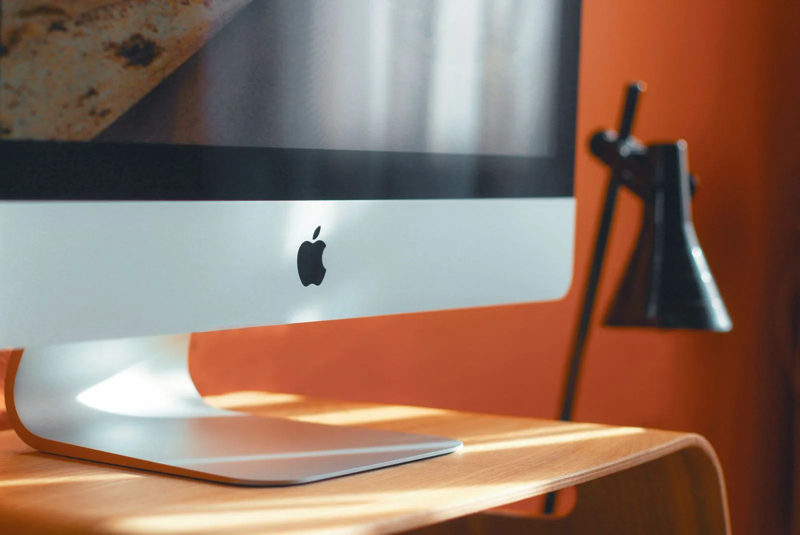 Desktop computer and desk lamp in a home office