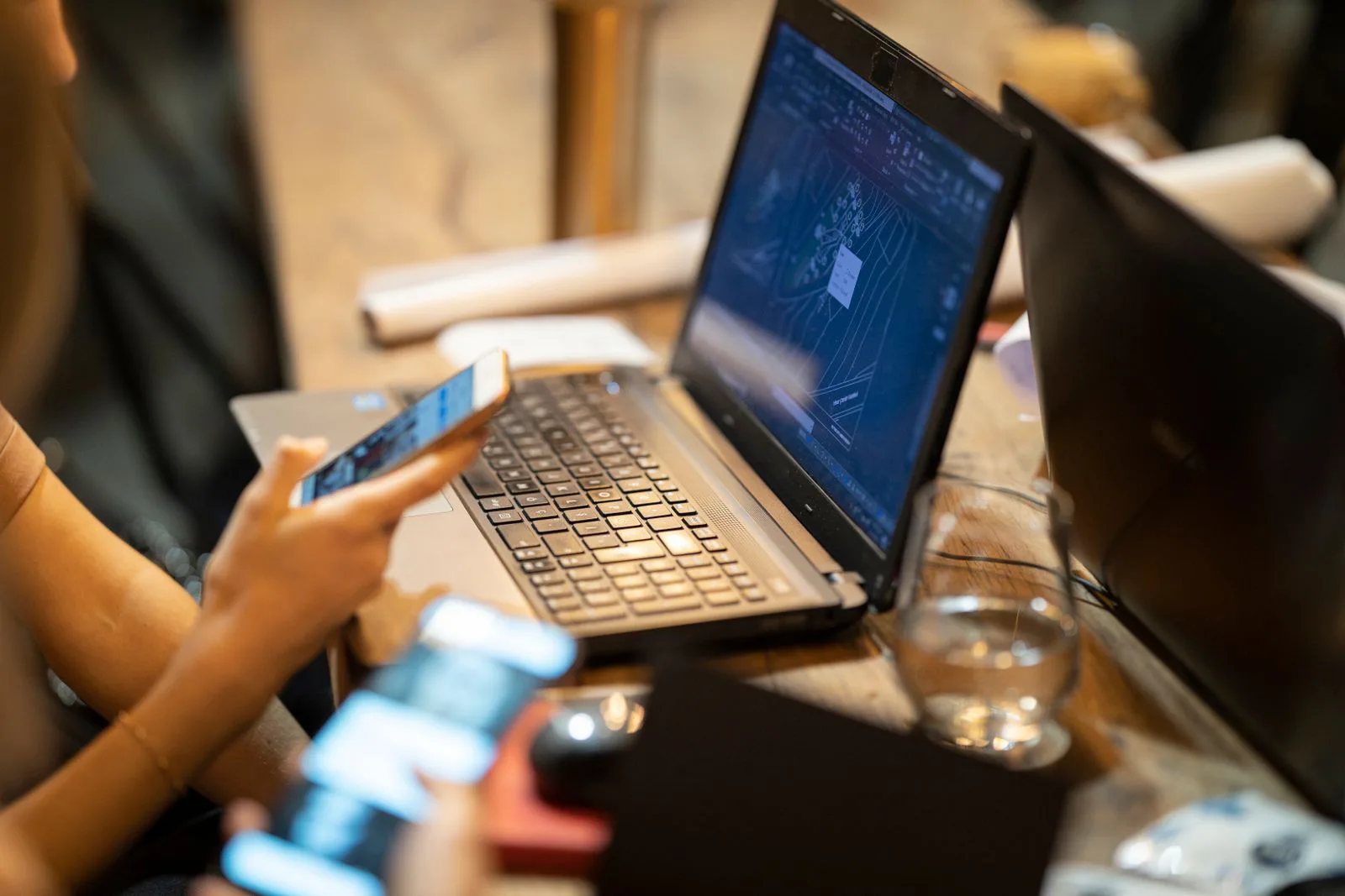 Laptop and smartphone in use on a desk