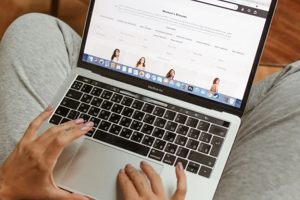 Person browsing a website on a laptop